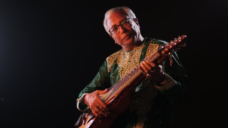 Pandit Debasis Chakroborty playing Indian slide guitar